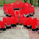 About 100 students sit in the formation of the AIDS ribbon during an AIDS awareness program held in their school, Wednesday Aug. 16, 2006 in Singapore.